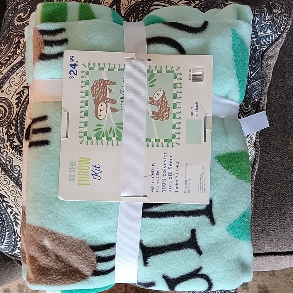Sloth design no sew blanket/throw kit. new, never opened.  Throw is 48x60.